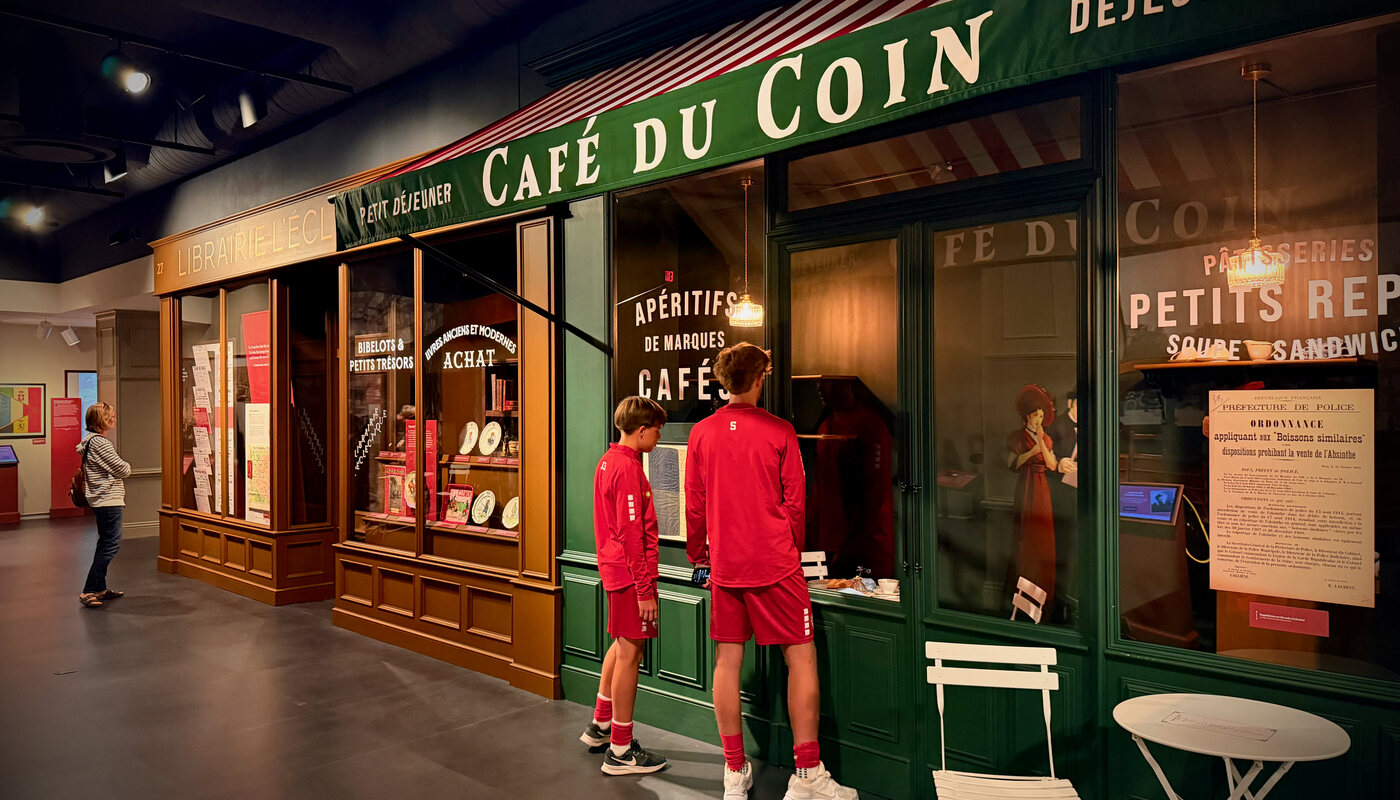 Paris at War exhibit featuring a recreated Café du Coin storefront