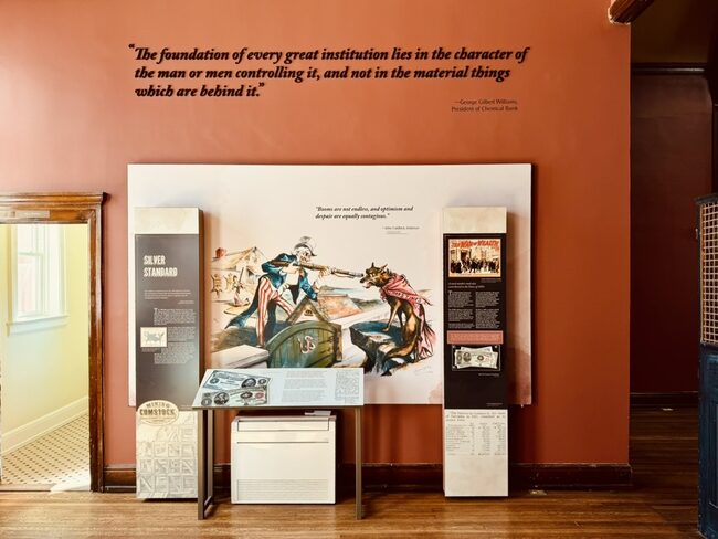 Farmers & Merchants Bank exhibit panel with historical illustration and quote