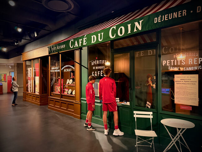 Paris at War exhibit featuring a recreated Café du Coin storefront