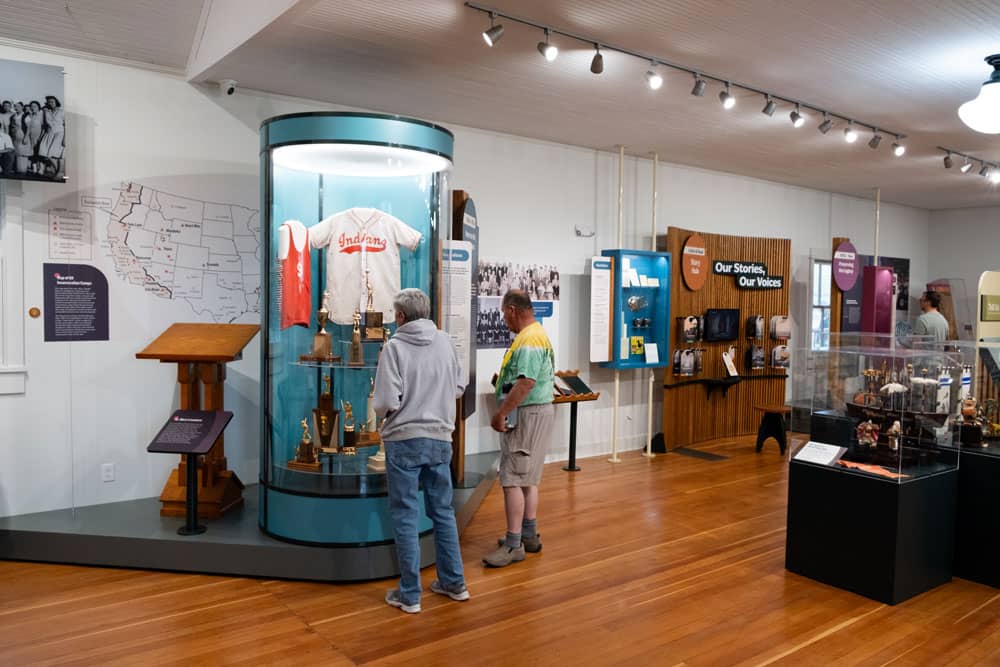 Graham Unruh interacting with the digital touchscreens on the exhibit columns.